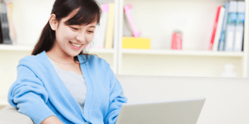 girl on laptop on couch